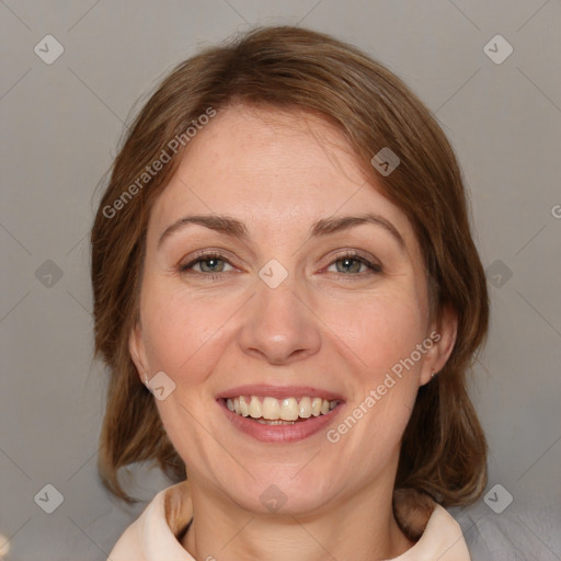 Joyful white adult female with medium  brown hair and grey eyes