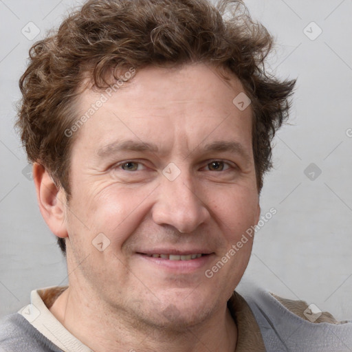 Joyful white adult male with short  brown hair and grey eyes