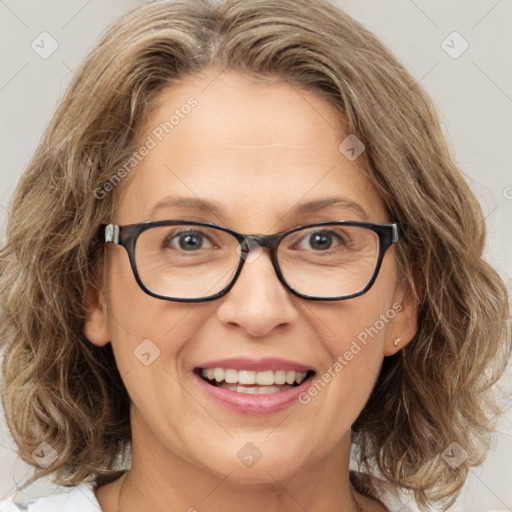 Joyful white adult female with medium  brown hair and blue eyes