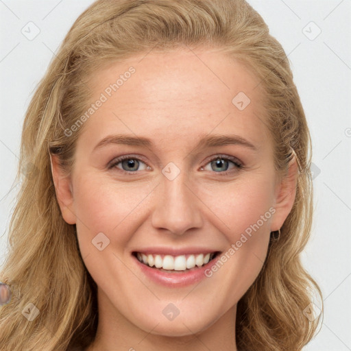 Joyful white young-adult female with long  brown hair and blue eyes