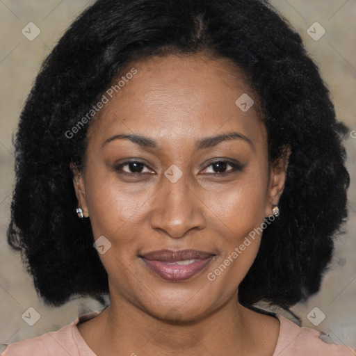 Joyful black adult female with medium  brown hair and brown eyes