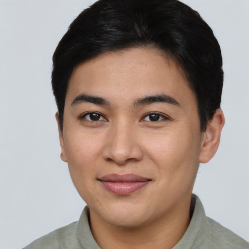 Joyful asian young-adult male with short  brown hair and brown eyes