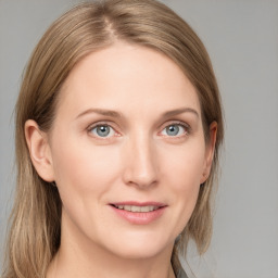 Joyful white young-adult female with medium  brown hair and blue eyes