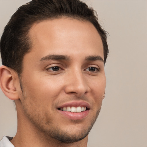 Joyful white young-adult male with short  brown hair and brown eyes