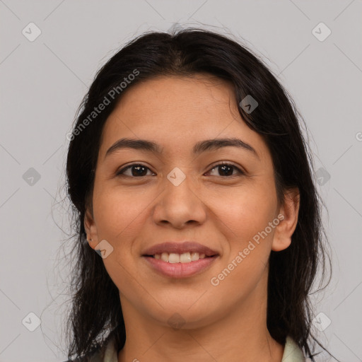 Joyful latino young-adult female with medium  brown hair and brown eyes