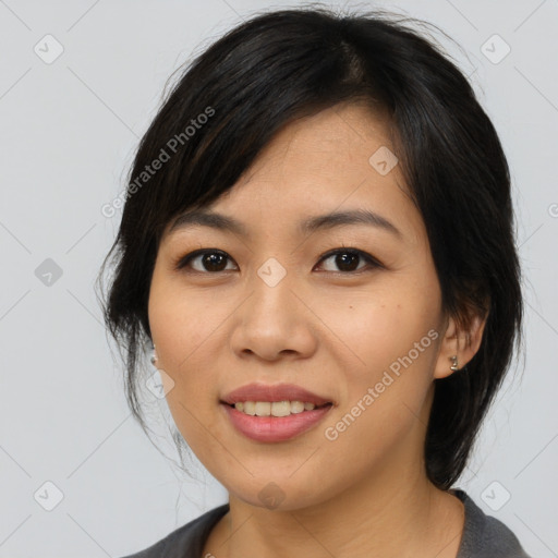 Joyful asian young-adult female with medium  black hair and brown eyes