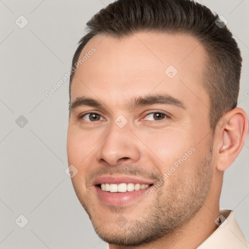 Joyful white young-adult male with short  brown hair and brown eyes