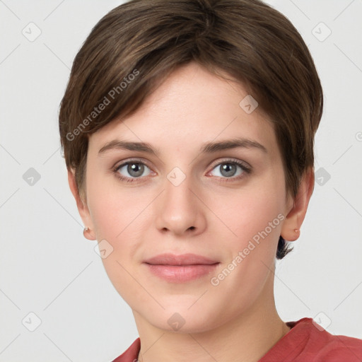 Joyful white young-adult female with short  brown hair and grey eyes