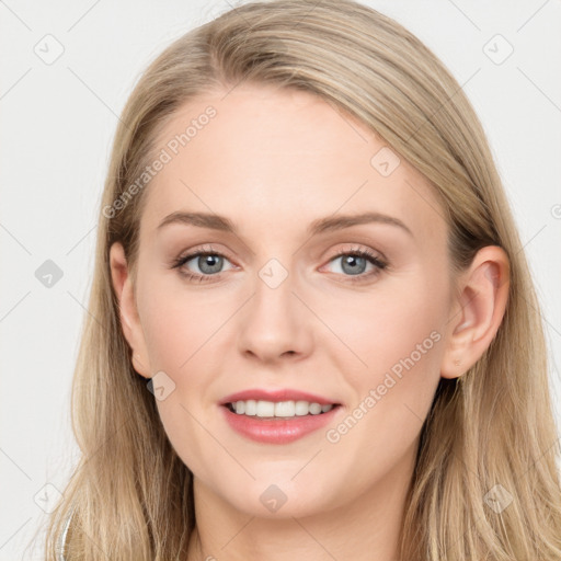 Joyful white young-adult female with long  brown hair and blue eyes