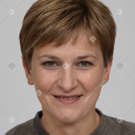 Joyful white adult female with short  brown hair and grey eyes