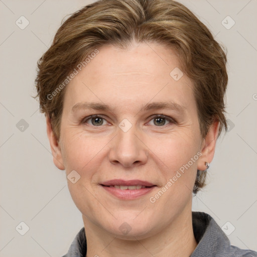 Joyful white adult female with short  brown hair and grey eyes