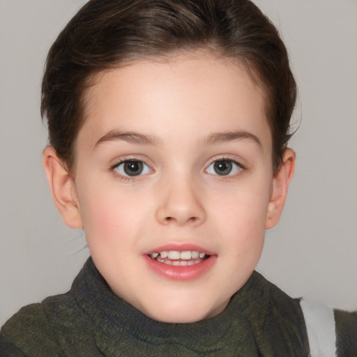 Joyful white child female with short  brown hair and brown eyes