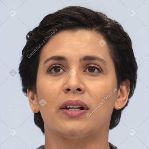 Joyful white adult female with short  brown hair and brown eyes