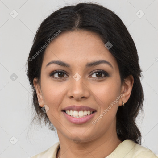 Joyful latino young-adult female with medium  brown hair and brown eyes