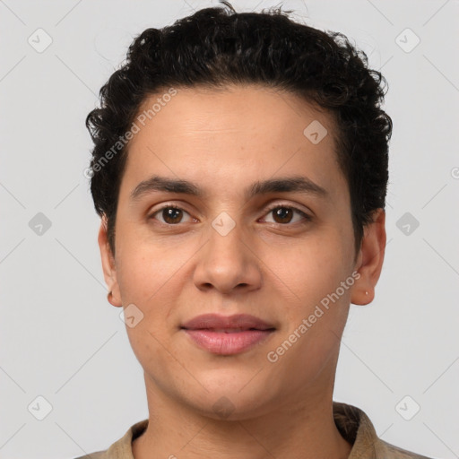 Joyful latino young-adult male with short  brown hair and brown eyes