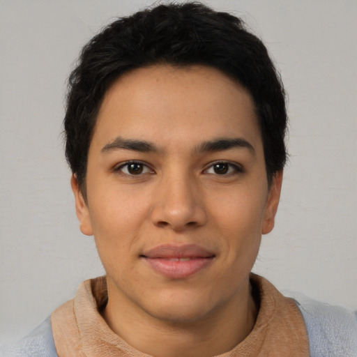 Joyful asian young-adult male with short  brown hair and brown eyes