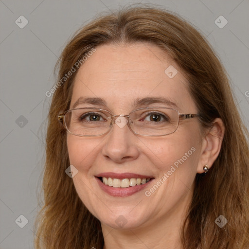 Joyful white adult female with long  brown hair and brown eyes