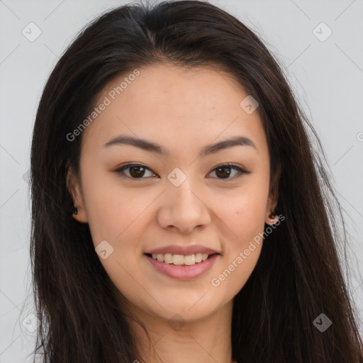 Joyful asian young-adult female with long  brown hair and brown eyes