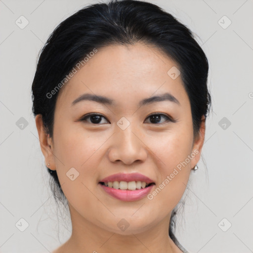 Joyful asian young-adult female with medium  black hair and brown eyes