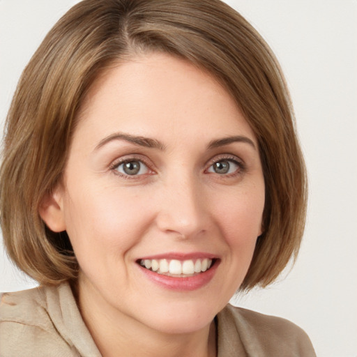 Joyful white young-adult female with medium  brown hair and brown eyes