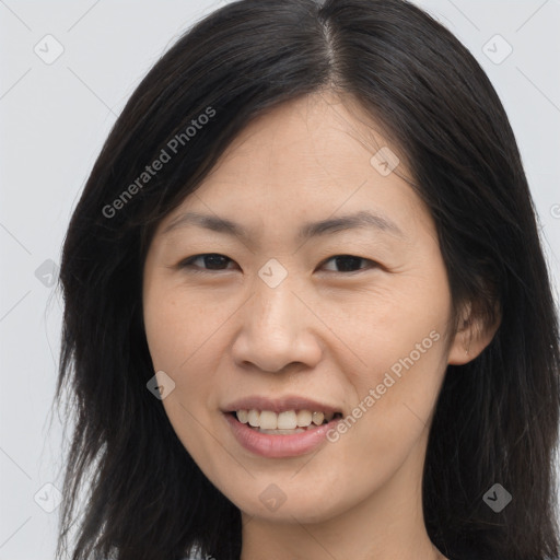 Joyful asian young-adult female with long  brown hair and brown eyes