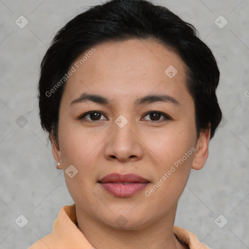 Joyful asian young-adult female with short  black hair and brown eyes