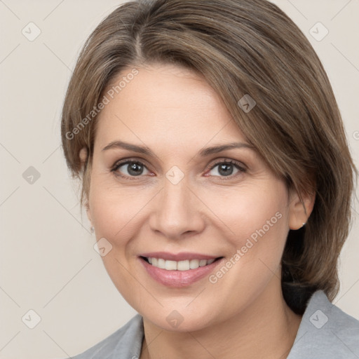 Joyful white adult female with medium  brown hair and grey eyes