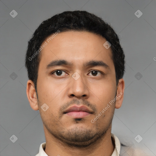 Neutral latino young-adult male with short  black hair and brown eyes