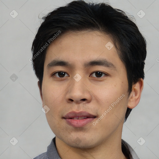 Joyful asian young-adult male with short  black hair and brown eyes