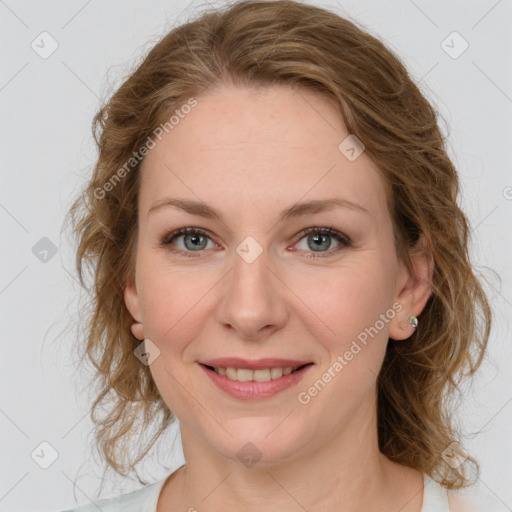 Joyful white young-adult female with medium  brown hair and green eyes