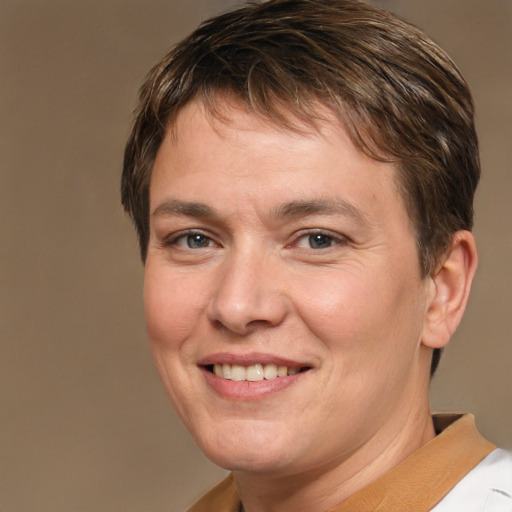 Joyful white adult female with short  brown hair and brown eyes