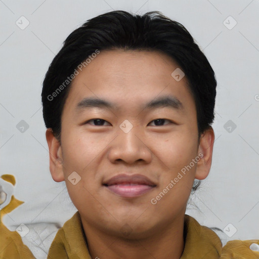 Joyful asian young-adult male with short  black hair and brown eyes