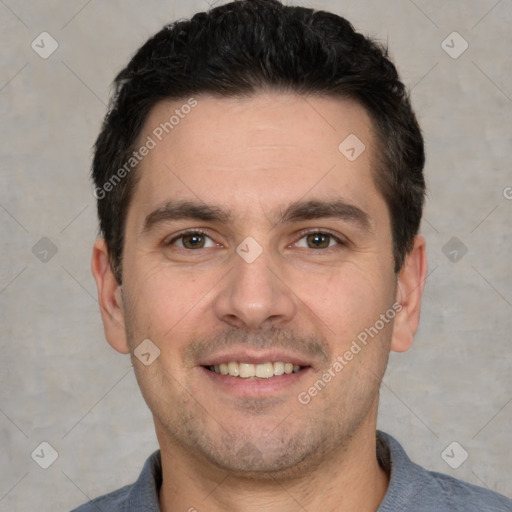 Joyful white young-adult male with short  black hair and brown eyes