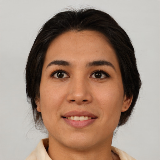 Joyful asian young-adult female with medium  brown hair and brown eyes