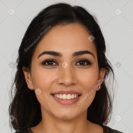 Joyful latino young-adult female with long  brown hair and brown eyes