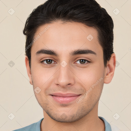 Joyful white young-adult male with short  brown hair and brown eyes