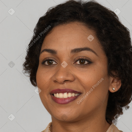 Joyful black young-adult female with medium  brown hair and brown eyes