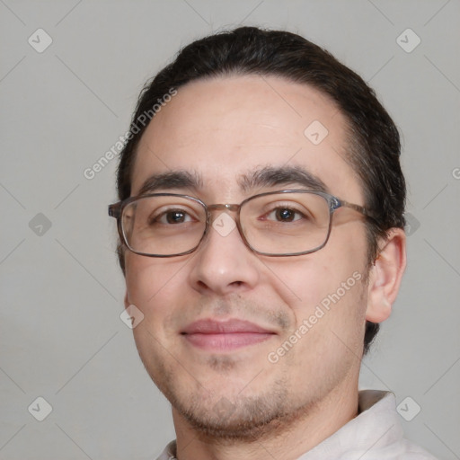 Joyful white adult male with short  brown hair and brown eyes