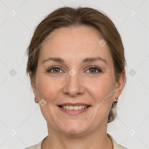 Joyful white adult female with medium  brown hair and grey eyes