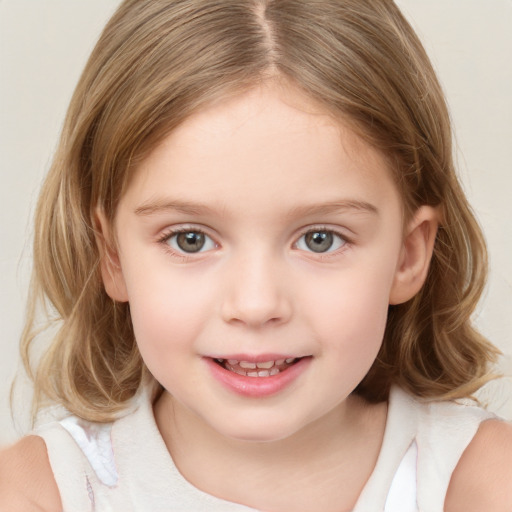 Joyful white child female with medium  brown hair and grey eyes