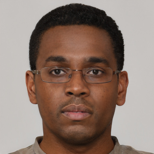 Neutral black young-adult male with short  black hair and brown eyes