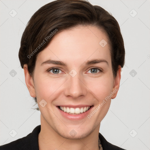 Joyful white young-adult female with short  brown hair and grey eyes