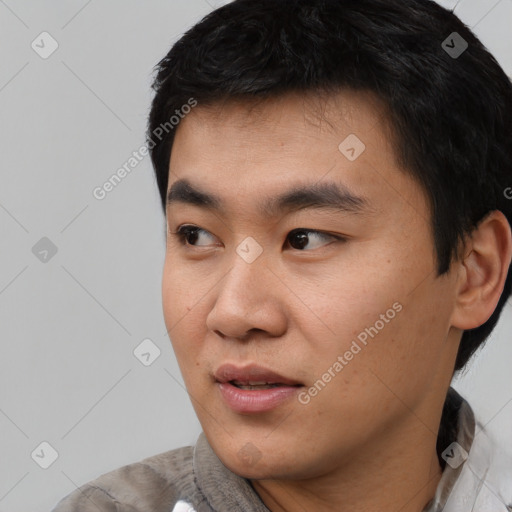 Neutral asian young-adult male with short  black hair and brown eyes