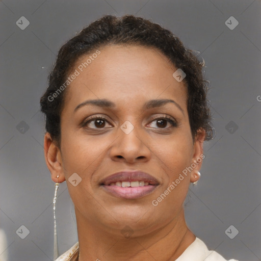 Joyful black adult female with short  brown hair and brown eyes