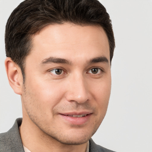 Joyful white young-adult male with short  brown hair and brown eyes