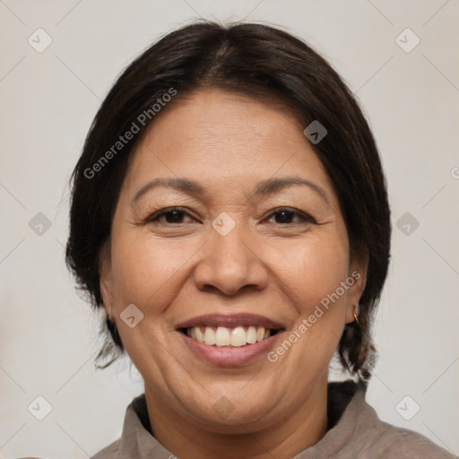 Joyful white adult female with medium  brown hair and brown eyes