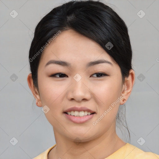 Joyful asian young-adult female with short  black hair and brown eyes