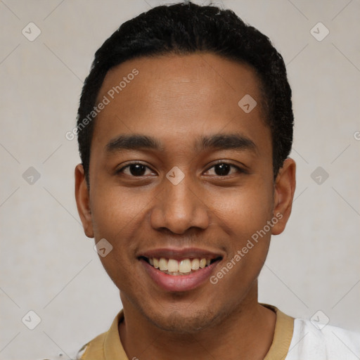 Joyful latino young-adult male with short  black hair and brown eyes