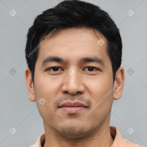 Joyful asian young-adult male with short  black hair and brown eyes