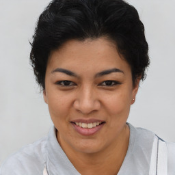 Joyful asian young-adult female with short  brown hair and brown eyes